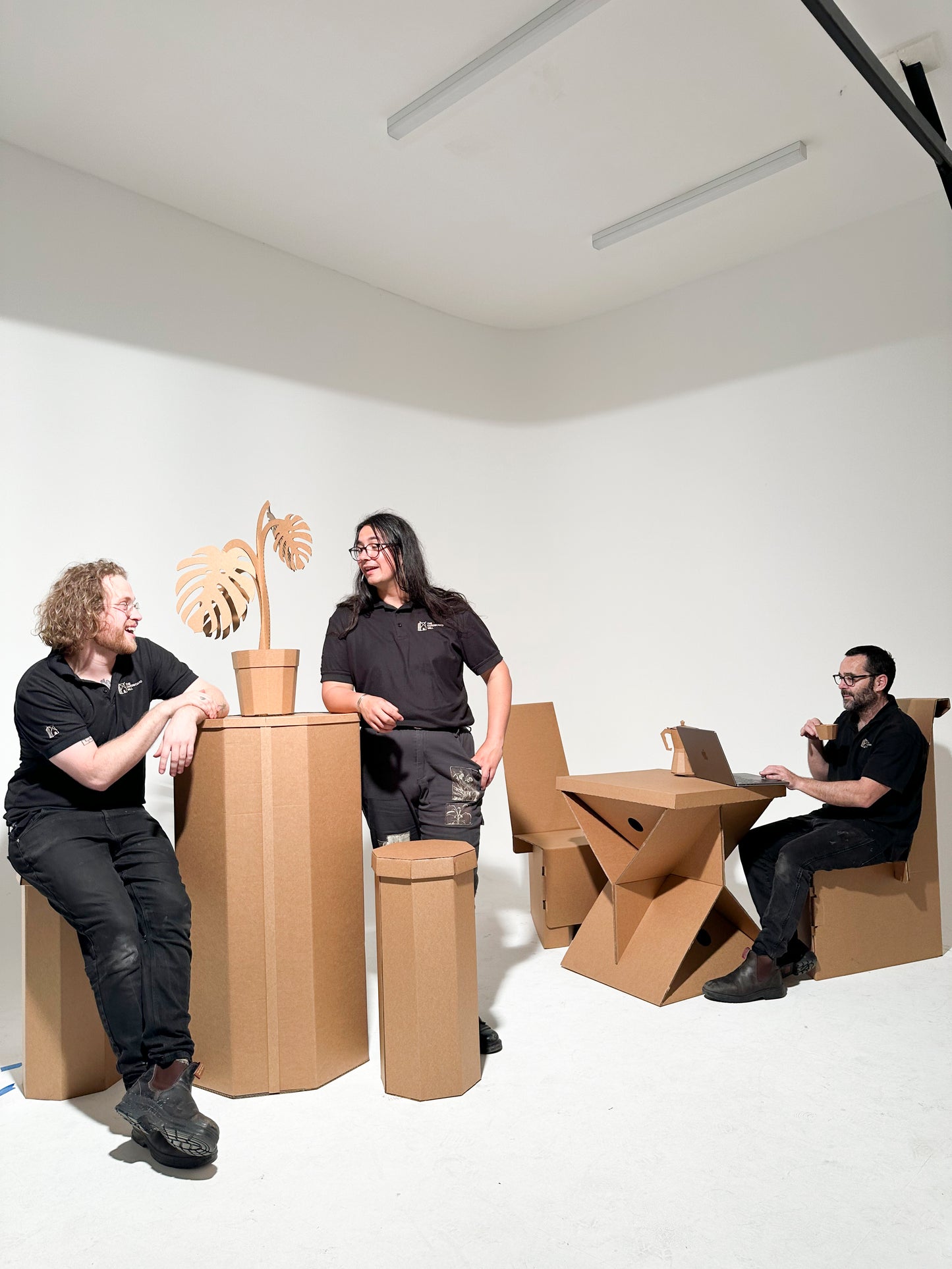 People using The Cardboard Mill range of cardboard stools, chairs and tables
