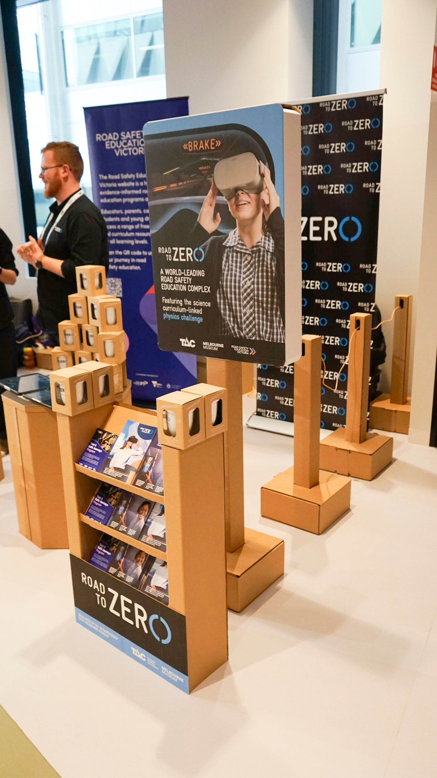 The Cardboard Mill tradeshow products in use with branding and items on shelves 