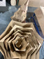 The pieces to a cardboard tree nested together ready for packaging and shipping